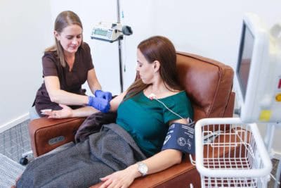 Patient receiving ketamine infusion treatment for depression in a clinical setting.