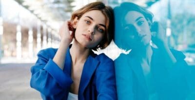 Young woman with bipolar disorder experiencing mood swings outdoors.